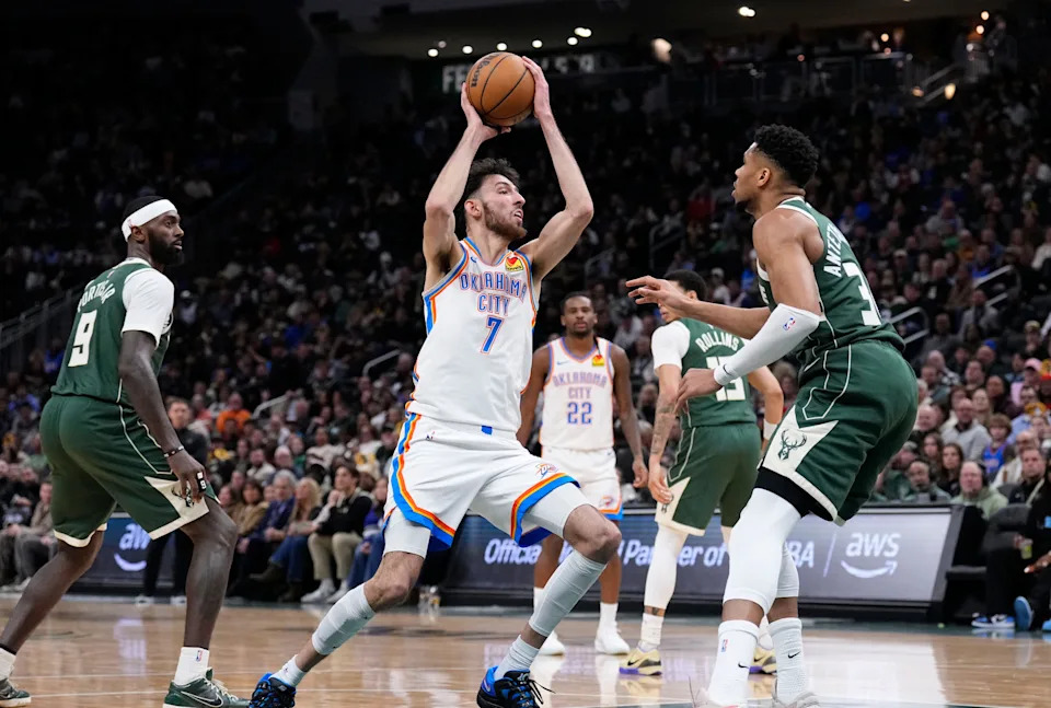 Jan 21, 2026; Milwaukee, Wisconsin, USA; Oklahoma City Thunder center/forward Chet Holmgren (7) drives to the basket against Milwaukee Bucks forward Giannis Antetokounmpo (34) in the first half at Fiserv Forum. Mandatory Credit: Michael McLoone-Imagn Images