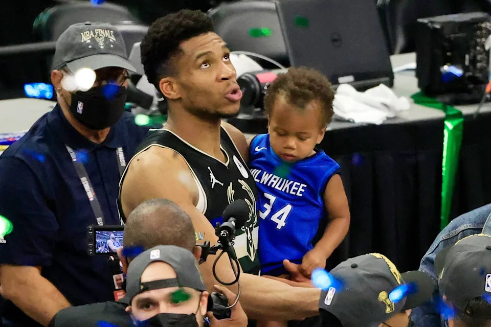 Justin Casterline/Getty Giannis Antetokounmpo #34 of the Milwaukee Bucks holds his son in July 2021.