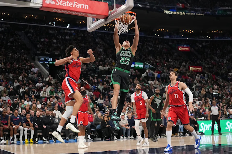 Jan 3, 2026; Inglewood, California, USA; Boston Celtics guard Jordan Walsh (27) dunks the ball against LA Clippers guard Kobe Sanders (4), forward Derrick Jones Jr. (5) and center Brook Lopez (11) in the second half at Intuit Dome. Mandatory Credit: Kirby Lee-Imagn Images