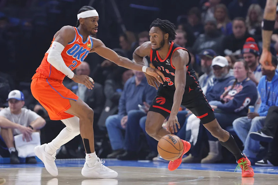 Jan 25, 2026; Oklahoma City, Oklahoma, USA; Toronto Raptors guard Immanuel Quickley (5) drives across the court as Oklahoma City Thunder guard Shai Gilgeous-Alexander (2) defends during the first quarter at Paycom Center. Mandatory Credit: Alonzo Adams-Imagn Images