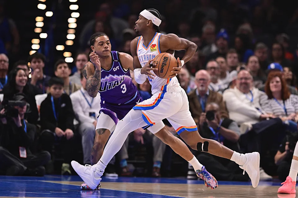 OKLAHOMA CITY, OKLAHOMA - JANUARY 7: Shai Gilgeous-Alexander #2 of the Oklahoma City Thunder handels the ball in front of Keyonte George #3 of the Utah Jazz during the first half at Paycom Center on January 7, 2026 in Oklahoma City, Oklahoma. NOTE TO USER: User expressly acknowledges and agrees that, by downloading and or using this photograph, User is consenting to the terms and conditions of the Getty Images License Agreement. (Photo by Joshua Gateley/Getty Images)