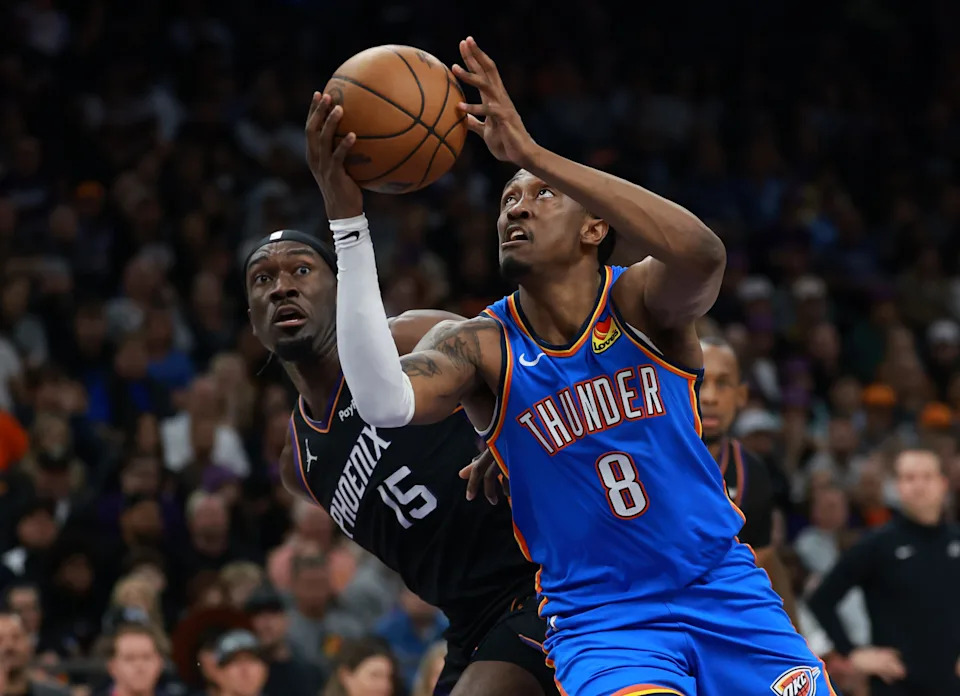 Jan 4, 2026; Phoenix, Arizona, USA; Oklahoma City Thunder guard Jalen Williams (8) drives to the basket against Phoenix Suns center Mark Williams (15) in the second half at Mortgage Matchup Center. Mandatory Credit: Mark J. Rebilas-Imagn Images
