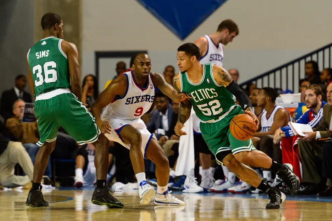 Oct 11, 2013; Newark, DE, USA; Boston Celtics guard Chris Babb (52) is defended by Philadelphia 76ers guard James Anderson (9) during the fourth quarter at Bob Carpenter Sports Convocation Center. The Sixers defeated the Celtics 97-85. Mandatory Credit: Howard Smith-USA TODAY Sports