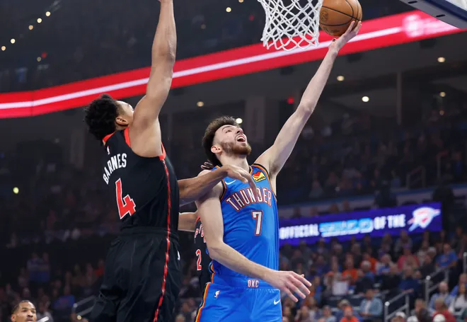 Feb 7, 2025; Oklahoma City, Oklahoma, USA; Oklahoma City Thunder forward Chet Holmgren (7) shoots beside Toronto Raptors forward Scottie Barnes (4) during the first quarter at Paycom Center. Mandatory Credit: Alonzo Adams-Imagn Images