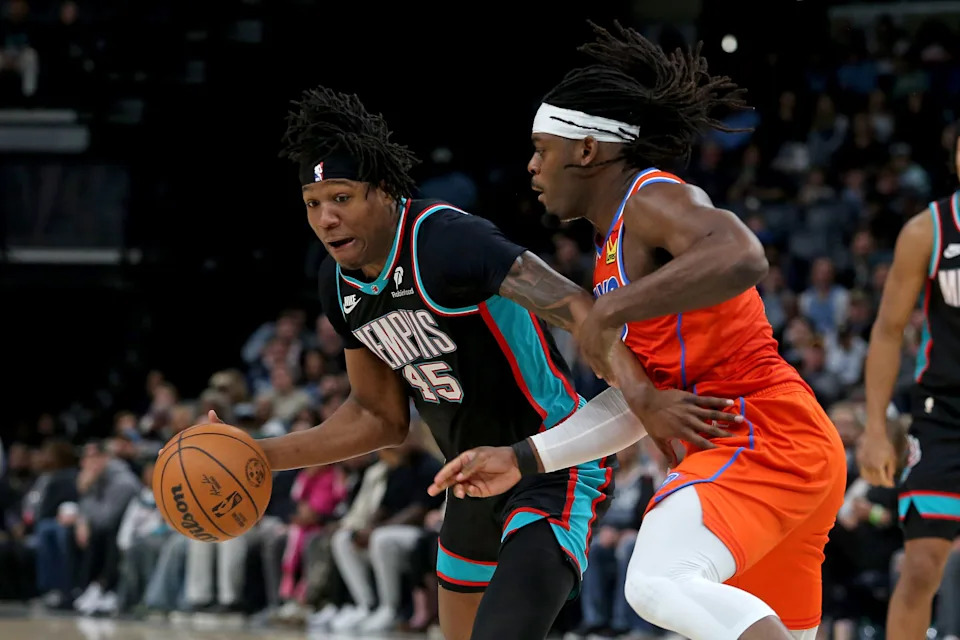 Jan 9, 2026; Memphis, Tennessee, USA; Memphis Grizzlies forward GG Jackson II (45) dribbles as Oklahoma City Thunder guard Luguentz Dort (5) defends during the third quarter at FedExForum. Mandatory Credit: Petre Thomas-Imagn Images
