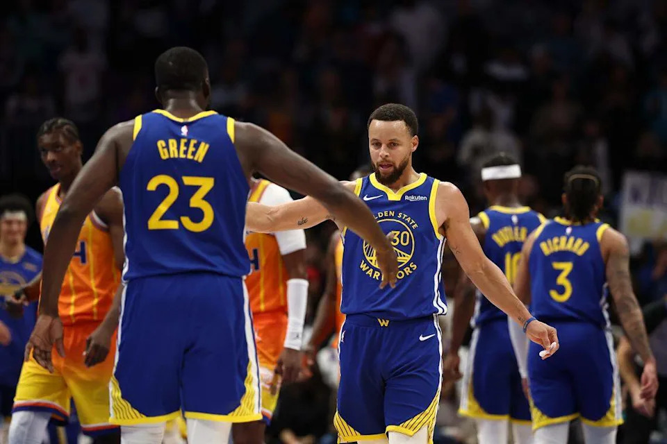 Draymond Green (23) and Stephen Curry (30) of the Golden State Warriors react during the fourth quarter of their Dec. 31, 2025 game against the Charlotte Hornets at Spectrum Center. Golden State beat the Hornets, 132-125.