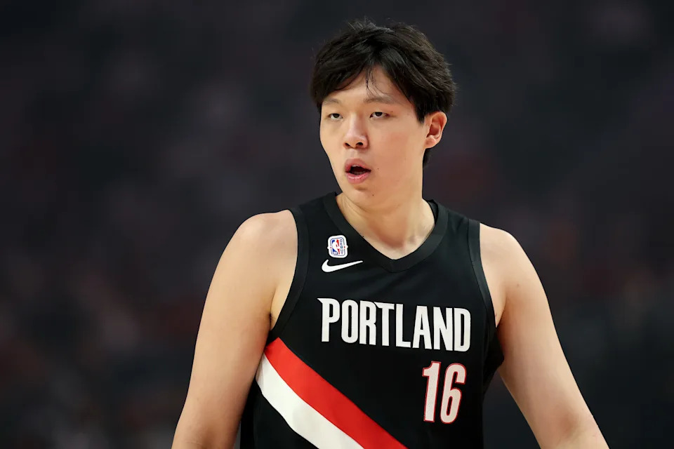 PORTLAND, OREGON - OCTOBER 22: Yang Hansen #16 of the Portland Trail Blazers looks on in his NBA debut against the Minnesota Timberwolves at Moda Center on October 22, 2025 in Portland, Oregon. NOTE TO USER: User expressly acknowledges and agrees that, by downloading and or using this photograph, User is consenting to the terms and conditions of the Getty Images License Agreement. (Photo by Steph Chambers/Getty Images)