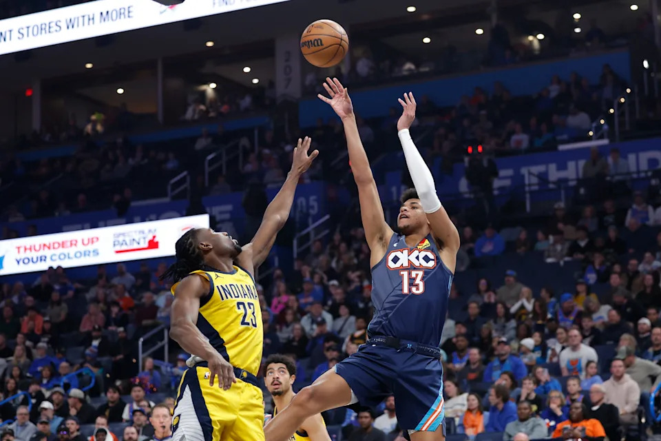 Jan 23, 2026; Oklahoma City, Oklahoma, USA; Oklahoma City Thunder forward Ousmane Dieng (13) shoots as Indiana Pacers guard/forward Aaron Nesmith (23) defends during the second quarter at Paycom Center. Mandatory Credit: Alonzo Adams-Imagn Images