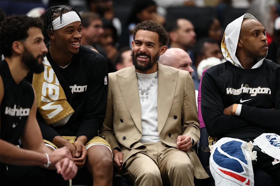 WASHINGTON, DC - JANUARY 09: Trae Young #3 of the Washington Wizards reacts on the bench with Bilal Coulibaly #0 and Khris Middleton #22 during the first half against the New Orleans Pelicans at Capital One Arena on January 9, 2026 in Washington, DC. NOTE TO USER: User expressly acknowledges and agrees that, by downloading and or using this photograph, User is consenting to the terms and conditions of the Getty Images License Agreement. (Photo by Scott Taetsch/Getty Images)