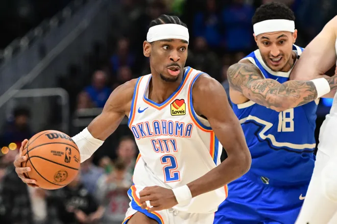 Mar 16, 2025; Milwaukee, Wisconsin, USA; Oklahoma City Thunder guard Shai Gilgeous-Alexander (2) drives for the basket against Milwaukee Bucks forward Kyle Kuzma (18) in the first quarter at Fiserv Forum. Mandatory Credit: Benny Sieu-Imagn Images