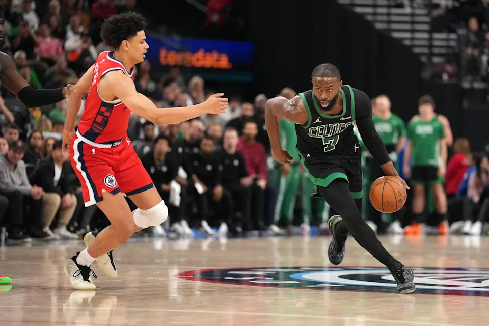 Jan 3, 2026; Inglewood, California, USA; Boston Celtics guard Jaylen Brown (7) dribbles the ball against LA Clippers guard Kobe Sanders (4) in the second half at Intuit Dome. Mandatory Credit: Kirby Lee-Imagn Images