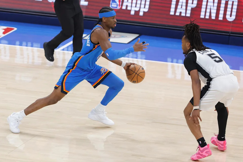 Jan 13, 2026; Oklahoma City, Oklahoma, USA; Oklahoma City Thunder guard Shai Gilgeous-Alexander (2) drives down the court as San Antonio Spurs guard Stephon Castle (5) defends during the first quarter at Paycom Center. Mandatory Credit: Alonzo Adams-Imagn Images