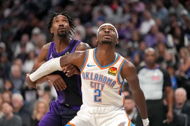 Nov 7, 2025; Sacramento, California, USA; Oklahoma City Thunder guard Shai Gilgeous-Alexander (2) battles for position with Sacramento Kings guard Malik Monk (0) in the second quarter at the Golden 1 Center. Mandatory Credit: Cary Edmondson-Imagn Images