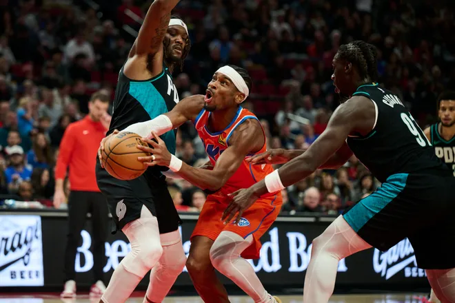 Nov 30, 2025; Portland, Oregon, USA; Oklahoma City Thunder guard Shai Gilgeous-Alexander (2) drives to the basket during the first half against Portland Trail Blazers center Robert Williams III (35) at Moda Center. Mandatory Credit: Troy Wayrynen-Imagn Images