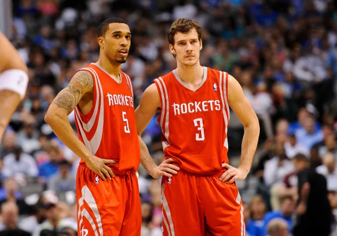 Apr 18, 2012; Dallas, TX, USA; Houston Rockets shooting guard Courtney Lee (5) and point guard Goran Dragic (3) wait for play to resume during the game against the Dallas Mavericks at the American Airlines Center. The Mavericks defeated the Rockets 117-110. Mandatory Credit: Jerome Miron-USA TODAY Sports