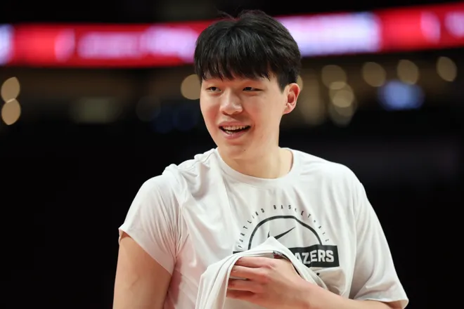 Dec 14, 2025; Portland, Oregon, USA; Portland Trail Blazers center Yang Hansen (16) looks on during warm ups before the game against the Golden State Warriors at Moda Center. Mandatory Credit: Jaime Valdez-Imagn Images