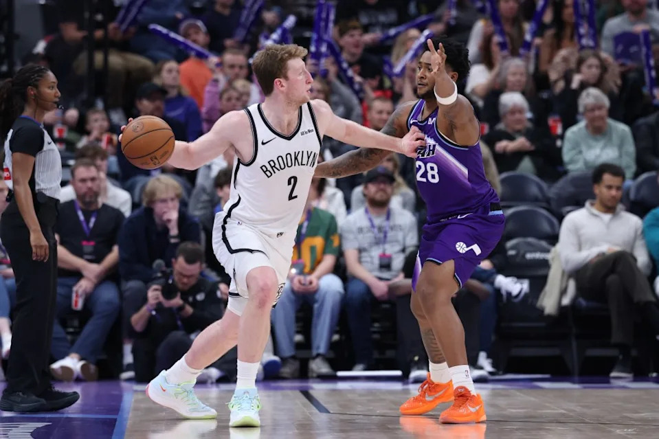 Danny Wolf looks to make a pass around Brice Sensabaugh during the second half of the Nets’ win over the Jazz. Rob Gray-Imagn Images