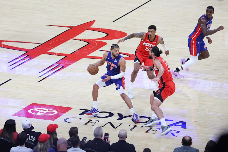 HOUSTON, TEXAS - OCTOBER 24: Cade Cunningham #2 of the Detroit Pistons is trapped by Steven Adams #12 and Jabari Smith Jr. #10 of the Houston Rockets in the first half of the game at Toyota Center on October 24, 2025 in Houston, Texas. (Photo by Kenneth Richmond/Getty Images)