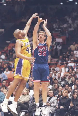 9 Mar 1997: Center Joe Kleine of the New Jersey Nets shoots the ball over center Sean Rooks of the Los Angeles Lakers during a game at the Great Western Forum in Inglewood, California. The Lakers won the game 115-105. Mandatory Credit: Elsa Hasch /Allsport