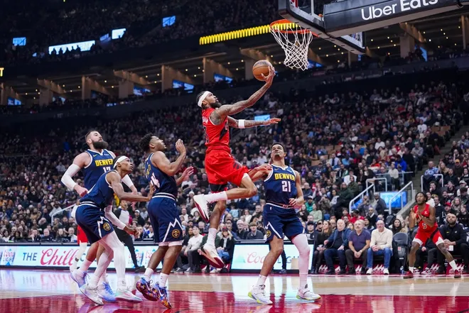 Dec 31, 2025; Toronto, Ontario, CAN; Toronto Raptors forward Brandon Ingram (3) drives to the basket against Denver Nuggets forward Spencer Jones (21) during the first half at Scotiabank Arena.