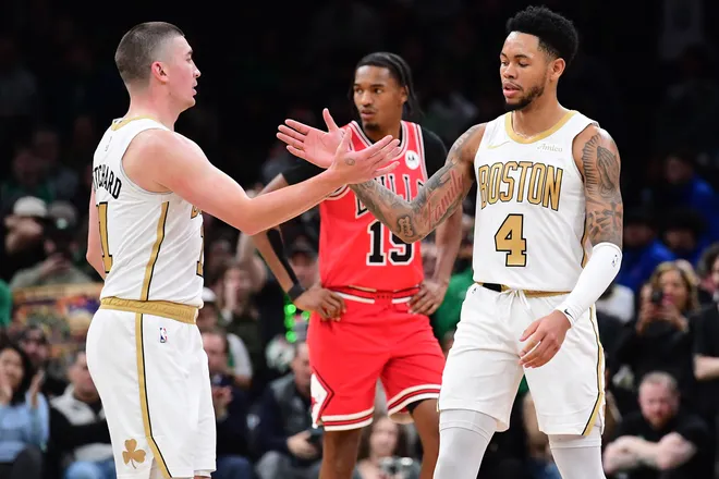 Jan 5, 2026; Boston, Massachusetts, USA; Boston Celtics guard Payton Pritchard (11) congratulates guard Anfernee Simons (4) after a basket during the second half against the Chicago Bulls at TD Garden. Mandatory Credit: Bob DeChiara-Imagn Images