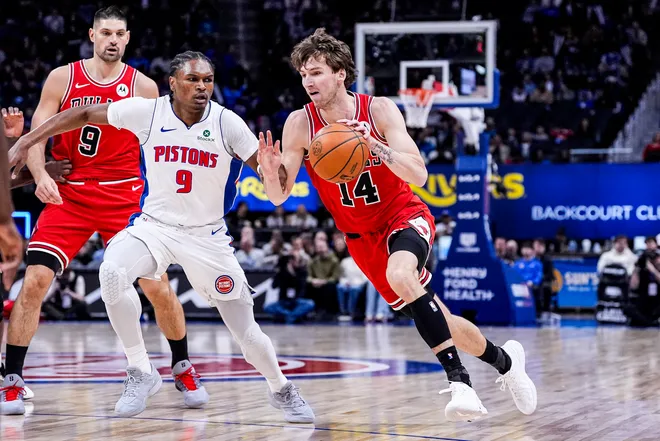 Chicago Bulls forward Matas Buzelis (14) dribbles against Detroit Pistons guard Ausar Thompson (9) during the first half at Little Caesars Arena in Detroit on Wednesday, Jan. 7, 2026.