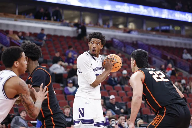 Nov 27, 2025; Chicago, Illinois, USA; Northwestern Wildcats forward Arrinten Page (22) reacts as he holds the ball during the second half at United Center.
