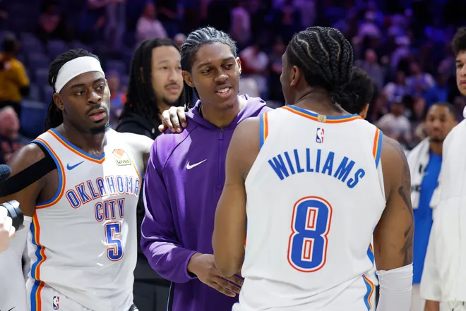 Jan 7, 2026; Oklahoma City, Oklahoma, USA; Utah Jazz forward Cody Williams (5) meets his brother Oklahoma City Thunder guard/forward Jalen Williams (8) after their game at Paycom Center. Mandatory Credit: Alonzo Adams-Imagn Images