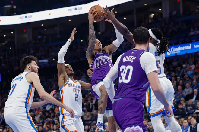 Jan 7, 2026; Oklahoma City, Oklahoma, USA; Utah Jazz guard Keyonte George (3) goes up for a basket between Oklahoma City Thunder guard Shai Gilgeous-Alexander (2) and guard Luguentz Dort (5) during the second half at Paycom Center. Mandatory Credit: Alonzo Adams-Imagn Images