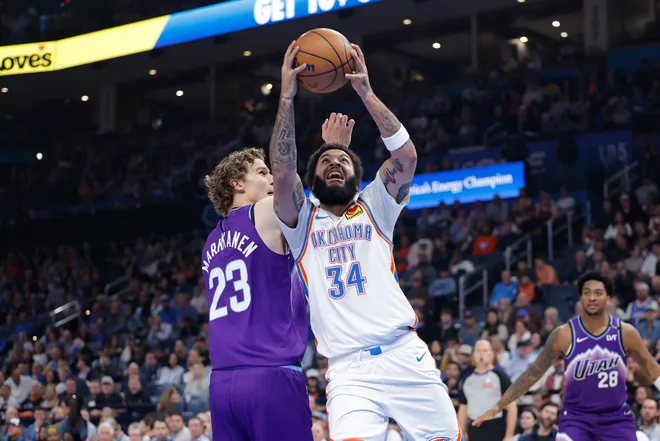 Jan 7, 2026; Oklahoma City, Oklahoma, USA; Oklahoma City Thunder guard/forward Kenrich Williams (34) goes up for a basket beside Utah Jazz forward/center Lauri Markkanen (23) during the second quarter at Paycom Center. Mandatory Credit: Alonzo Adams-Imagn Images