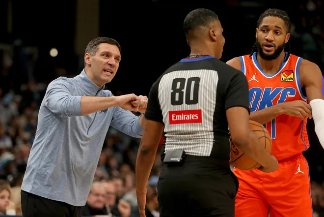 Jan 9, 2026; Memphis, Tennessee, USA; Oklahoma City Thunder head coach Mark Daigneault and guard Isaiah Joe (11) react toward an official during the third quarter against the Memphis Grizzlies at FedExForum. Mandatory Credit: Petre Thomas-Imagn Images