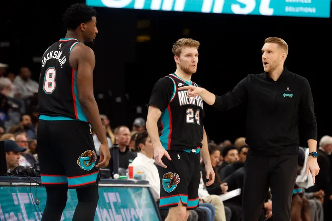 Jan 9, 2026; Memphis, Tennessee, USA; Memphis Grizzlies head coach Tuomas Iisalo talks with forward/center Jaren Jackson Jr. (8) and guard Cam Spencer (24) as they check in to the game during the third quarter against the Oklahoma City Thunder at FedExForum. Mandatory Credit: Petre Thomas-Imagn Images