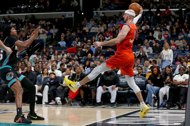 Jan 9, 2026; Memphis, Tennessee, USA; Oklahoma City Thunder guard Alex Caruso (9) saves the ball from going out of bounds during the fourth quarter against the Memphis Grizzlies at FedExForum. Mandatory Credit: Petre Thomas-Imagn Images