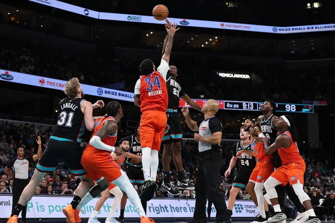 MEMPHIS, TENNESSEE - JANUARY 09: Cedric Coward #23 of the Memphis Grizzlies and Kenrich Williams #34 of the Oklahoma City Thunder jump for the ball during the second half at FedExForum on January 09, 2026 in Memphis, Tennessee. NOTE TO USER: User expressly acknowledges and agrees that, by downloading and or using this photograph, user is consenting to the terms and conditions of the Getty Images License Agreement. (Photo by Justin Ford/Getty Images)