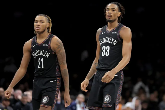 Jan 9, 2026; Brooklyn, New York, USA; Brooklyn Nets forward Noah Clowney (21) and center Nic Claxton (33) react during the fourth quarter against the Los Angeles Clippers at Barclays Center.