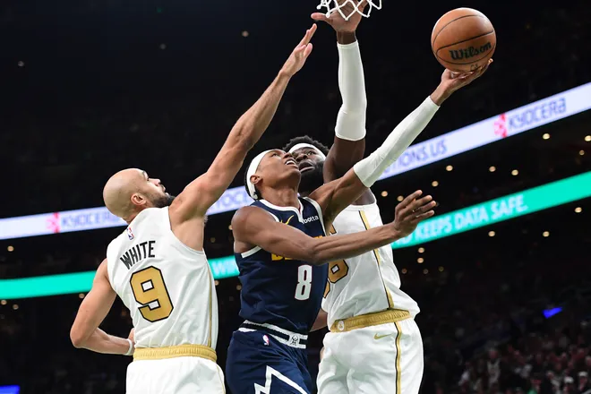 Jan 7, 2026; Boston, Massachusetts, USA; Denver Nuggets guard Peyton Watson (8) drives to the basket between Boston Celtics forward Josh Minott (8) and center Neemias Queta (88) during the second half at TD Garden. Mandatory Credit: Bob DeChiara-Imagn Images