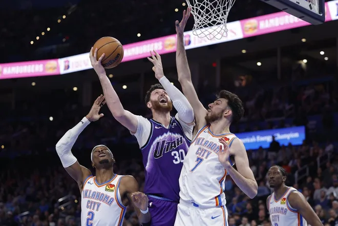 Jan 7, 2026; Oklahoma City, Oklahoma, USA; Utah Jazz center Jusuf Nurkić (30) shoots between Oklahoma City Thunder guard Shai Gilgeous-Alexander (2) and center/forward Chet Holmgren (7) during the second half at Paycom Center.