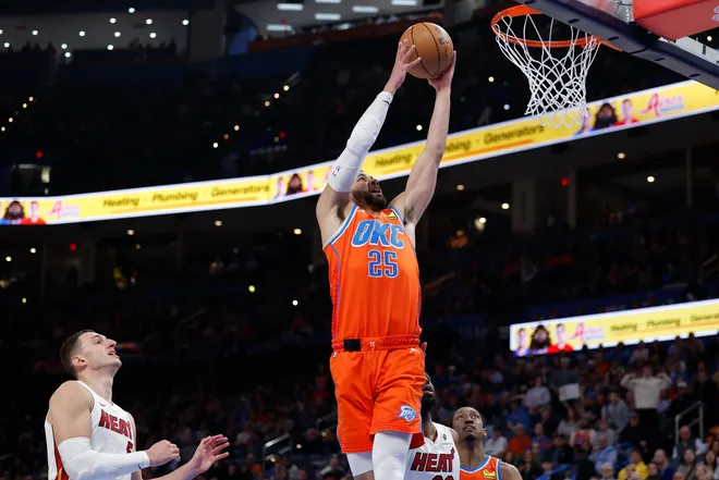 Jan 11, 2026; Oklahoma City, Oklahoma, USA; Oklahoma City Thunder guard Ajay Mitchell (25) goes to the basket against the Miami Heat during the second half at Paycom Center. Mandatory Credit: Alonzo Adams-Imagn Images