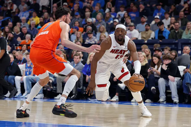 Jan 11, 2026; Oklahoma City, Oklahoma, USA; Miami Heat center/forward Bam Adebayo (13) drives to the basket as Oklahoma City Thunder center/forward Chet Holmgren (7) defends during the second quarter at Paycom Center. Mandatory Credit: Alonzo Adams-Imagn Images