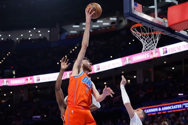 Jan 11, 2026; Oklahoma City, Oklahoma, USA; Oklahoma City Thunder center/forward Chet Holmgren (7) goes up for a basket against the Miami Heat during the second half at Paycom Center. Mandatory Credit: Alonzo Adams-Imagn Images