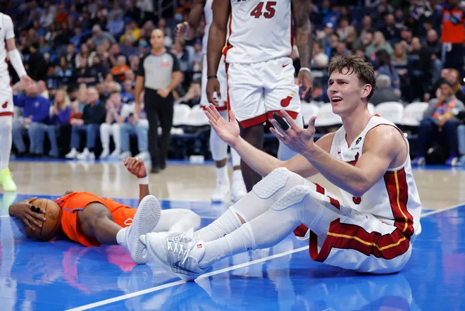 Jan 11, 2026; Oklahoma City, Oklahoma, USA; Miami Heat guard Pelle Larsson (9) reacts after a play against the Oklahoma City Thunder during the second half at Paycom Center. Mandatory Credit: Alonzo Adams-Imagn Images