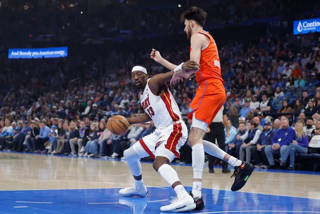 Jan 11, 2026; Oklahoma City, Oklahoma, USA; Miami Heat center/forward Bam Adebayo (13) drives to the basket against Oklahoma City Thunder center/forward Chet Holmgren (7) during the first quarter at Paycom Center. Mandatory Credit: Alonzo Adams-Imagn Images