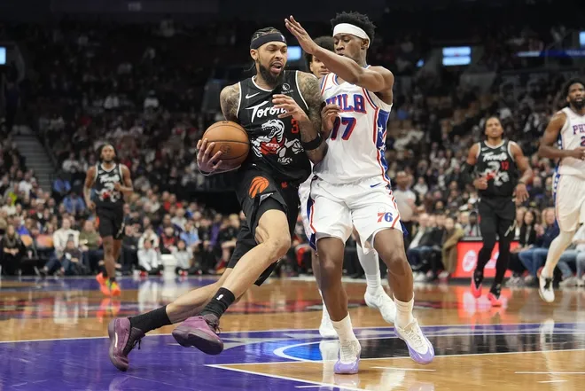Jan 12, 2026; Toronto, Ontario, CAN; Toronto Raptors forward Brandon Ingram (3) drives to the net against Philadelphia 76ers guard VJ Edgecombe (77) during the second half at Scotiabank Arena.