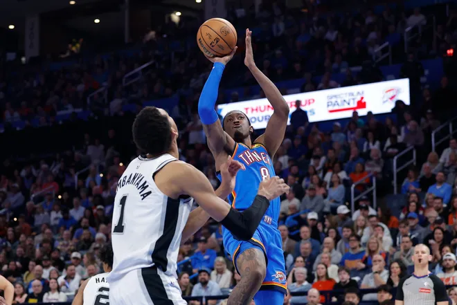 Jan 13, 2026; Oklahoma City, Oklahoma, USA; Oklahoma City Thunder guard/forward Jalen Williams (8) shoots over San Antonio Spurs forward/center Victor Wembanyama (1) during the second half at Paycom Center. Mandatory Credit: Alonzo Adams-Imagn Images