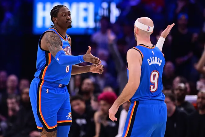 OKLAHOMA CITY, OKLAHOMA - JANUARY 13: Jalen Williams #8 and Alex Caruso #9 of the Oklahoma City Thunder high-five during the second half against the San Antonio Spurs at Paycom Center on January 13, 2026 in Oklahoma City, Oklahoma. NOTE TO USER: User expressly acknowledges and agrees that, by downloading and or using this photograph, User is consenting to the terms and conditions of the Getty Images License Agreement. (Photo by Joshua Gateley/Getty Images)