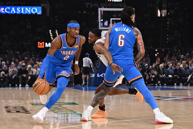 OKLAHOMA CITY, OKLAHOMA - JANUARY 13: Shai Gilgeous-Alexander #2 of the Oklahoma City Thunder handles the ball during the first half against the San Antonio Spurs at Paycom Center on January 13, 2026 in Oklahoma City, Oklahoma. NOTE TO USER: User expressly acknowledges and agrees that, by downloading and or using this photograph, User is consenting to the terms and conditions of the Getty Images License Agreement. (Photo by Joshua Gateley/Getty Images)
