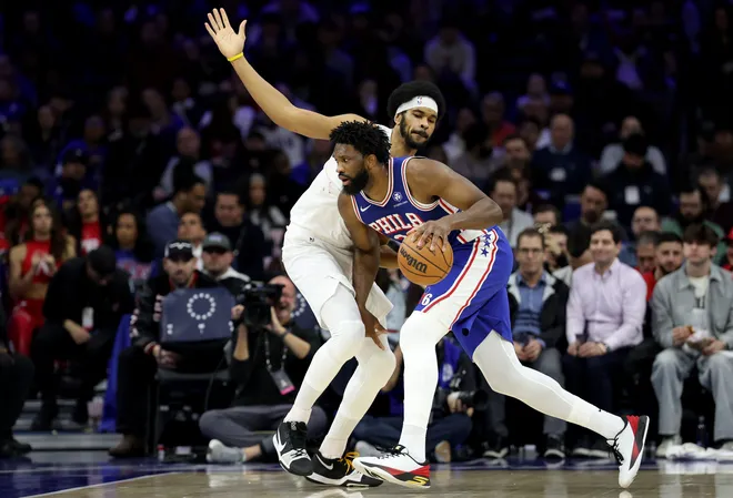 PHILADELPHIA, PENNSYLVANIA - JANUARY 14: Joel Embiid #21 of the Philadelphia 76ers drives against Jarrett Allen #31 of the Cleveland Cavaliers during the first half at Xfinity Mobile Arena on January 14, 2026 in Philadelphia, Pennsylvania. NOTE TO USER: User expressly acknowledges and agrees that, by downloading and or using this photograph, User is consenting to the terms and conditions of the Getty Images License Agreement. (Photo by Emilee Chinn/Getty Images)