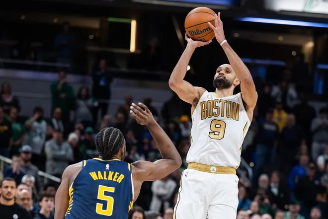 Jan 12, 2026; Indianapolis, Indiana, USA; Boston Celtics guard Derrick White (9) shoots the ball while Indiana Pacers forward Jarace Walker (5) defends in the second half at Gainbridge Fieldhouse.
