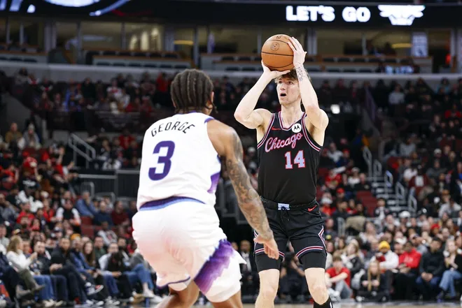 Jan 14, 2026; Chicago, Illinois, USA; Chicago Bulls forward Matas Buzelis (14) shoots against Utah Jazz guard Keyonte George (3) during the second half at United Center.