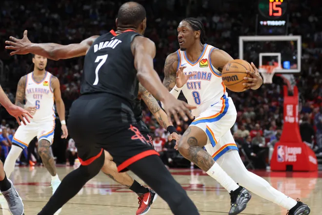 Jan 15, 2026; Houston, Texas, USA; Oklahoma City Thunder guard Jalen Williams (8) dribbles the ball as Houston Rockets forward Kevin Durant (7) defends during the third quarter at Toyota Center. Mandatory Credit: Troy Taormina-Imagn Images
